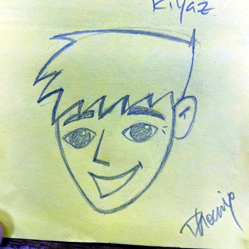 Pen sketch on a green sticky note of a grinning character named Riyaz with spiky hair.
